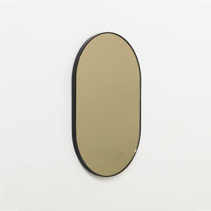 Capsula™ Capsule shaped Bronze Contemporary Mirror with a Black Frame