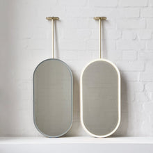 In Stock Capsula™ Ceiling Suspended Contemporary Mirror with a Brass Frame and Front Illumination