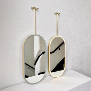 Capsula™ Ceiling Suspended Contemporary Mirror with a Brass Frame and Front Illumination