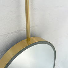 Capsula™ Ceiling Suspended Contemporary Mirror with a Brass Frame and Front Illumination