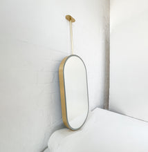 Capsula™ Ceiling Suspended Contemporary Mirror with a Brass Frame and Front Illumination
