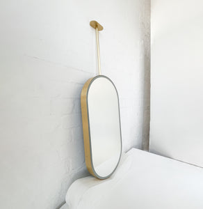 Capsula™ Ceiling Suspended Contemporary Mirror with a Brass Frame and Front Illumination