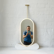Capsula™ Ceiling Suspended Contemporary Mirror with a Brass Frame and Front Illumination