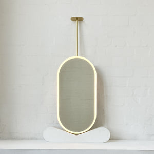 Capsula™ Ceiling Suspended Contemporary Mirror with a Brass Frame and Front Illumination