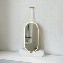 Capsula™ Ceiling Suspended Contemporary Mirror with a Brass Frame and Front Illumination