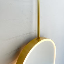 Capsula™ Ceiling Suspended Contemporary Mirror with a Brass Frame and Front Illumination
