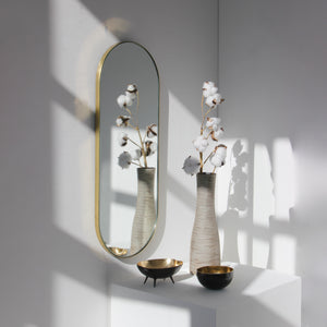 Capsula™ Capsule shaped Modern Mirror with an Elegant Brass Frame