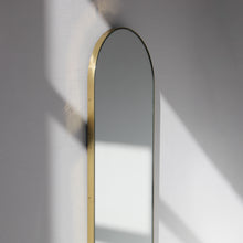 Capsula™ Capsule shaped Modern Mirror with an Elegant Brass Frame