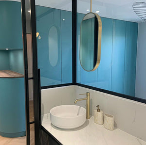 Capsula™ Ceiling Suspended Contemporary Mirror with a Brass Frame and Front Illumination