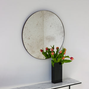 Orbis™ Antiqued Round Mirror with a Handcrafted Bronze Patina Frame