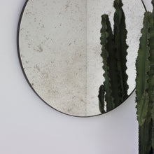 Orbis™ Antiqued Round Mirror with a Handcrafted Bronze Patina Frame