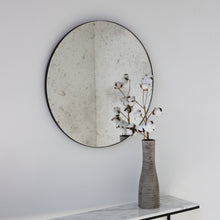 Orbis™ Antiqued Round Mirror with a Handcrafted Bronze Patina Frame