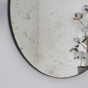 Orbis™ Antiqued Round Mirror with a Handcrafted Bronze Patina Frame