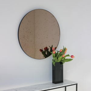 Orbis™ Antiqued Bronze Tinted Round Elegant Mirror with a Black Frame