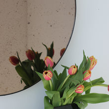 Orbis™ Antiqued Bronze Tinted Round Elegant Mirror with a Black Frame