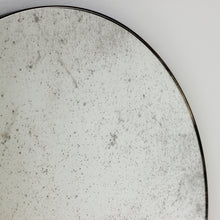 Orbis™ Antiqued Round Mirror with a Handcrafted Bronze Patina Frame