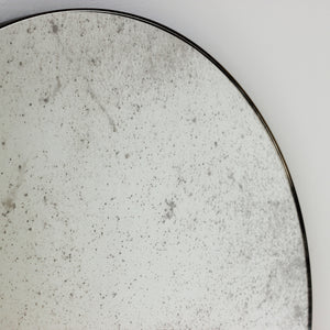 Orbis™ Antiqued Round Mirror with a Handcrafted Bronze Patina Frame