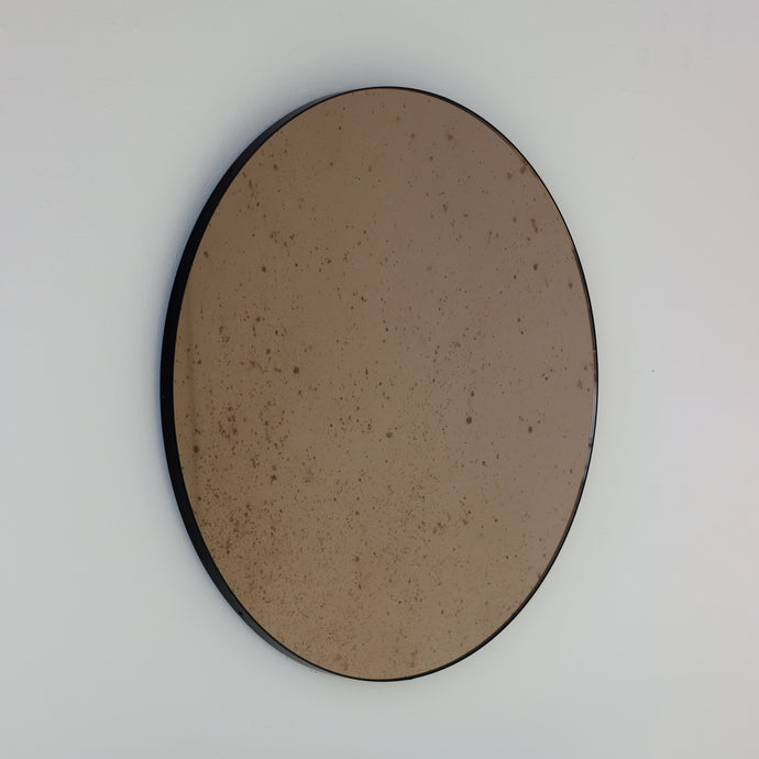 Orbis™ Antiqued Bronze Tinted Round Elegant Mirror with a Black Frame