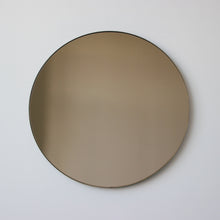 Orbis™ Bronze Tinted Round Contemporary Mirror with a Bronze Patina Brass Frame