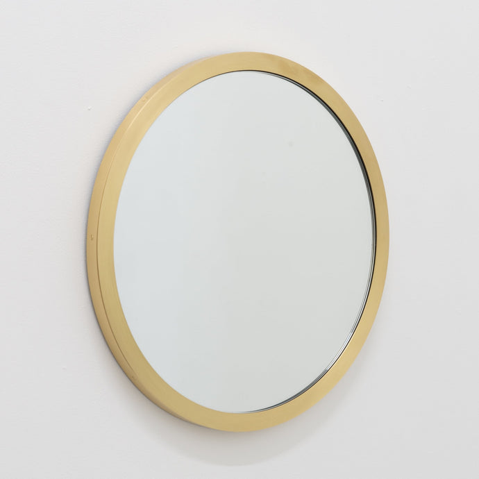 Orbis™ round mirror with a full solid brushed brass frame