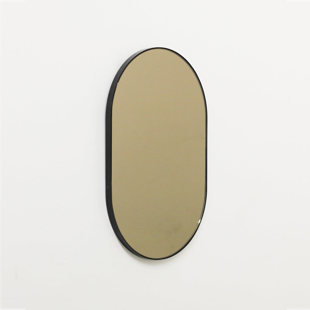Capsula™ Capsule shaped Bronze Contemporary Mirror with a Black Frame