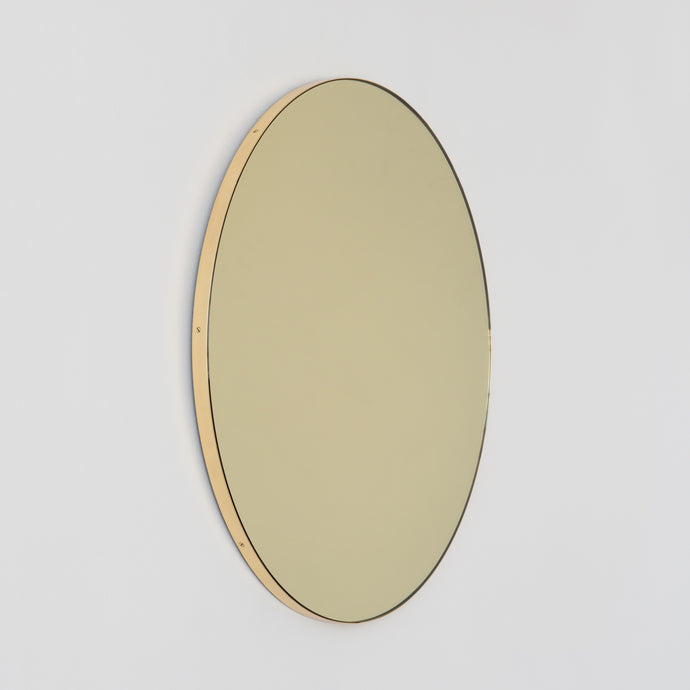 Orbis™ Round Gold Tinted Contemporary Mirror with a Brass Frame