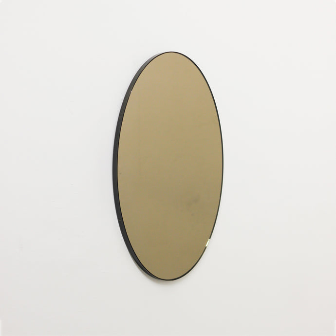 Ovalis™ Oval shaped Bronze Contemporary Mirror with Brass Patina Frame
