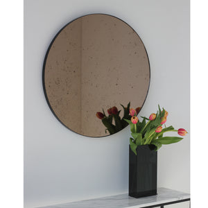 Orbis™ Antiqued Bronze Tinted Round Elegant Mirror with a Black Frame