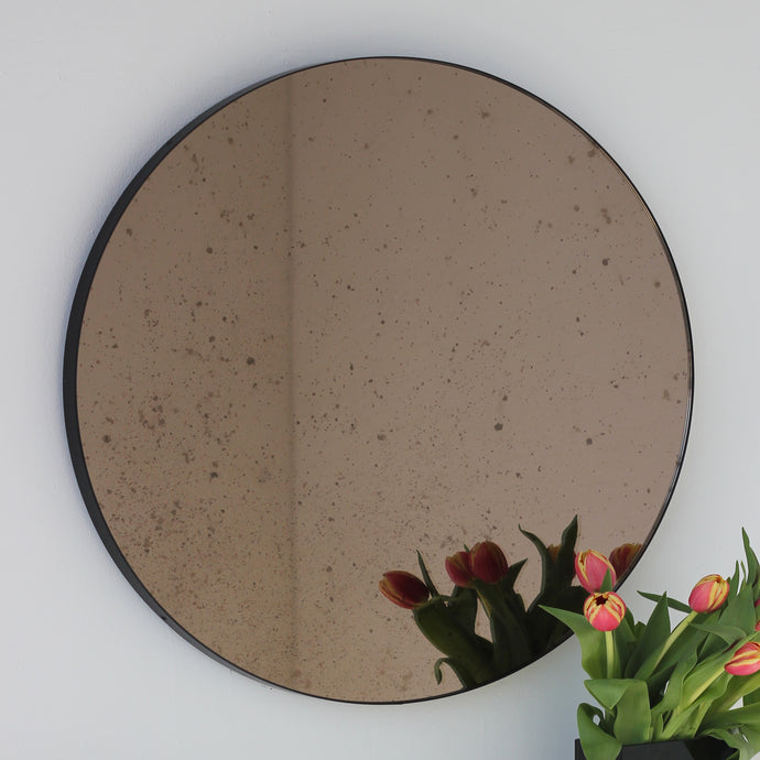 Orbis™ Antiqued Bronze Tinted Round Elegant Mirror with a Black Frame