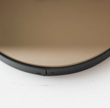 Orbis™ Bronze Tinted Round Contemporary Mirror with a Black Frame